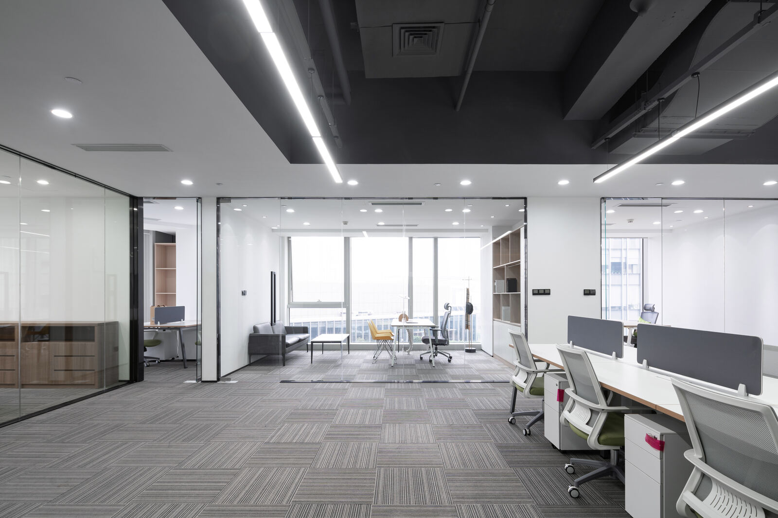 Rows of workstations in a bright open office